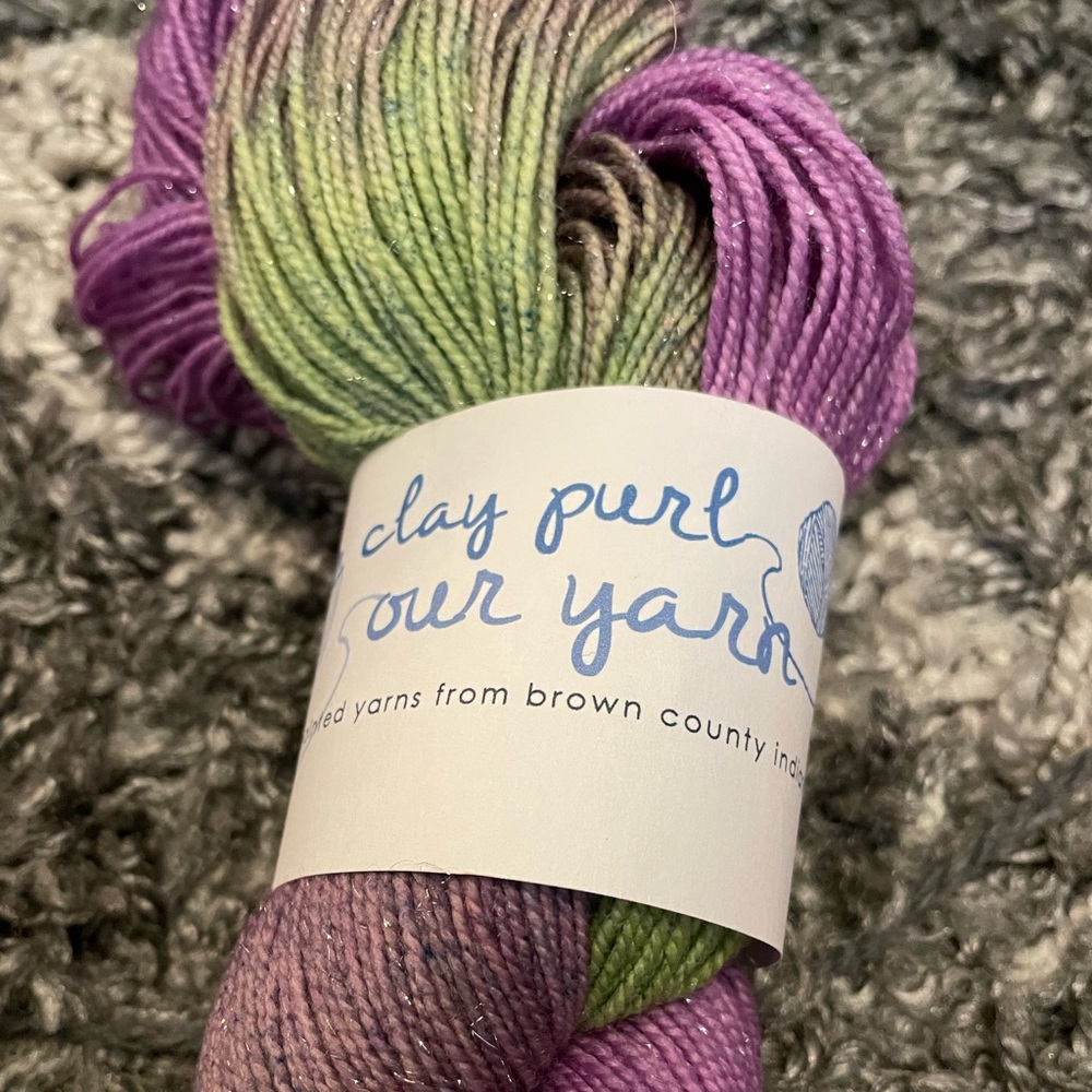 The Clay Purl hand painted Sparkle Socks “Wild Violets” yarn